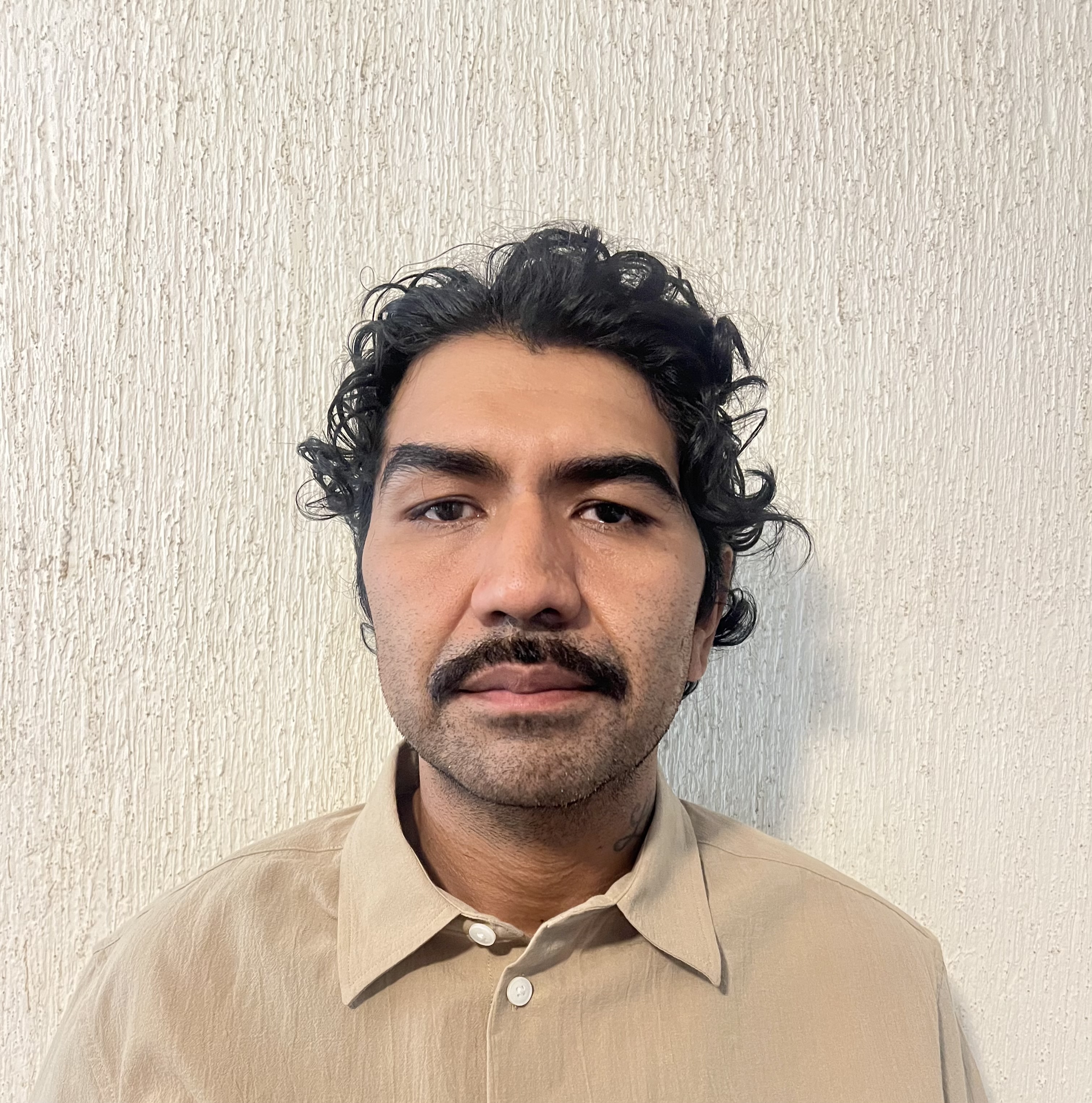 Luis E.